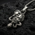 Load image into Gallery viewer, Oxidized 925 sterling silver Medusa skull pendant on volcanic rock, snake-wrapped memento mori necklace with detailed gothic face relief