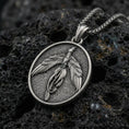 Load image into Gallery viewer, Oxidized 925 sterling silver phoenix pendant on volcanic rock, rising bird medallion necklace with detailed feather relief
