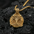 Load image into Gallery viewer, Gold plated yggdrasil tree of life pendant on volcanic rock, viking norse necklace with intricate knotwork frame