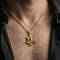 Load image into Gallery viewer, Gold plated trinacria pendant worn on neck, sicilian triskelion medusa necklace bright shine and premium texture