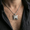 Load image into Gallery viewer, Polished silver lamassu necklace worn on neck, Mesopotamian protection amulet pendant with sharp detailing