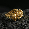 Load image into Gallery viewer, Gold plated motorcycle chain ring with winged engine motif on volcanic rock, premium macro photo emphasizing warm tone, raised mechanical texture and bold biker style