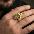 Load image into Gallery viewer, Gold plated geisha skull ring worn on a finger, close-up lifestyle image showing the carved skull mouth and traditional hairpin details