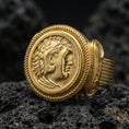 Load image into Gallery viewer, Gold plated Greek coin ring with classical profile portrait and rope edge bezel, product-only macro on black volcanic rock