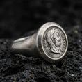 Load image into Gallery viewer, Oxidized sterling silver Roman coin ring featuring an Augustus emperor profile and Latin lettering, macro photo on black volcanic rock