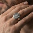 Load image into Gallery viewer, Oxidized coin portrait signet ring worn on a finger, close-up lifestyle shot highlighting the bearded ruler relief