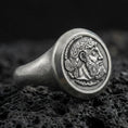 Load image into Gallery viewer, Oxidized sterling silver ancient coin signet ring with bearded ruler portrait relief, macro photo on black volcanic rock