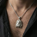 Load image into Gallery viewer, Polished silver deity head pendant necklace worn on neck, clean lifestyle wear shot, crisp shine and depth