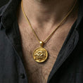Load image into Gallery viewer, Gold plated guardian lion medallion necklace worn on neck, premium styling, medallion as focal point with chain detail