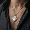 Load image into Gallery viewer, Polished silver koi fish necklace worn on neck, clean lifestyle framing, reflective finish and sharp engraved details