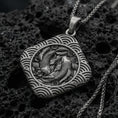 Load image into Gallery viewer, Oxidized sterling silver koi fish pendant on volcanic rock, twin koi relief in framed medallion, macro studio shot