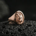 Load image into Gallery viewer, Rose gold plated fox head signet ring on volcanic rock, textured lava stone background, refined fox portrait engraving