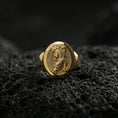 Load image into Gallery viewer, Gold plated Asian tiger signet ring on volcanic rock, premium studio scene, powerful predator motif with sharp relief detail