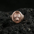 Load image into Gallery viewer, Rose gold plated bear signet ring on volcanic rock, textured lava stone background, detailed bear face engraving and depth