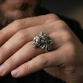 Load image into Gallery viewer, Oxidized angry lion king ring worn on finger, lifestyle close-up, roaring lion head statement ring with rugged styling