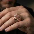 Load image into Gallery viewer, Rose gold plated angry lion king ring worn on finger, lifestyle wear photo, warm plating tone highlighting sculpted lion mane