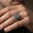 Load image into Gallery viewer, Oxidized Masonic signet ring worn on a finger, close-up lifestyle photo highlighting the square and compass “G” emblem