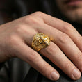 Load image into Gallery viewer, Gold plated Masonic skull ring worn on a finger, close-up lifestyle image focusing on the skull face and compass symbol