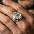 Load image into Gallery viewer, Polished silver Saint Peter ring on the finger, wearable macro focusing on the Keys of Heaven relief and ornate side detailing