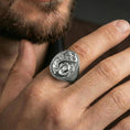 Load image into Gallery viewer, Polished silver finish anchor and snake signet ring on the finger, macro lifestyle image showing crisp anchor lines and coiled serpent detail