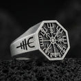 Load image into Gallery viewer, Sterling silver Vegvisir signet ring with an oxidized finish, Viking runic compass engraved on an octagonal face, macro on black volcanic rock