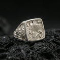 Load image into Gallery viewer, 925 sterling silver crane signet ring on volcanic stone, polished silver finish with clean edges, sharp relief details, and a rectangular face