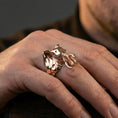 Load image into Gallery viewer, Rose gold plated elephant ring on finger, close-up lifestyle photo emphasizing statement look and engraved elephant features