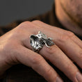 Load image into Gallery viewer, Oxidized elephant head ring worn on finger, lifestyle close-up showing bold trunk and tusk silhouette