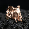 Load image into Gallery viewer, Rose gold plated elephant ring on volcanic rock surface, crisp close-up showcasing engraved lines and bold animal design
