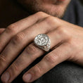 Load image into Gallery viewer, Polished silver koi ring on finger, natural hand pose highlighting the Japanese wave relief and clean circular bezel