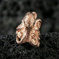Load image into Gallery viewer, Rose gold plated octopus ring on volcanic rock, sharp macro product photo showcasing the octopus head and curled tentacles in high detail
