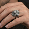 Load image into Gallery viewer, Oxidized lion head ring worn on finger, bold statement look with aggressive high-relief carving