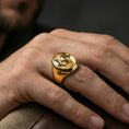 Load image into Gallery viewer, Gold plated elephant signet ring worn on finger, lifestyle wear shot emphasizing the bold oval top and safari-inspired elephant design