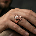Load image into Gallery viewer, Rose gold plated elephant ring on finger, close-up lifestyle photo showcasing the detailed elephant head relief and classic signet silhouette