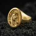 Load image into Gallery viewer, Gold plated horse signet ring on porous volcanic stone, premium dark studio shot emphasizing the equestrian profile relief and bold round signet top
