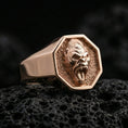 Load image into Gallery viewer, Rose gold plated gorilla signet ring on porous volcanic rock with dramatic shadows and sharp facial texture