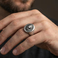 Load image into Gallery viewer, Oxidized lion signet ring worn on finger, lifestyle close-up emphasizing the bold roaring lion head and vintage-inspired depth