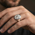 Load image into Gallery viewer, Polished silver lion signet ring on finger, natural hand pose highlighting the detailed mane carving and clean round signet profile