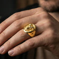 Load image into Gallery viewer, Gold plated ram head ring worn on a finger with dark minimal background, emphasizing the statement silhouette