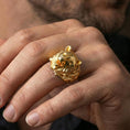 Load image into Gallery viewer, Gold plated bear ring worn on a finger against a dark minimal background, strong statement jewelry styling