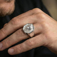 Load image into Gallery viewer, Polished silver wolf signet ring on a hand, close-up highlighting the crisp octagon frame and engraving depth