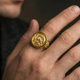 Load image into Gallery viewer, Gold plated koi fish ring worn on a finger against a dark background, premium statement styling