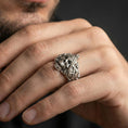Load image into Gallery viewer, Polished silver finish Masonic skull ring on the finger, macro lifestyle image focusing on the ornate carvings and symbolic Freemason-inspired skull design