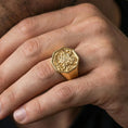 Load image into Gallery viewer, Sterling silver Armenian coat of arms ring worn on a finger, close-up lifestyle photo showcasing the gold plated finish and bold octagonal crest design