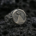 Load image into Gallery viewer, Sterling silver all-seeing eye pyramid signet ring with an oxidized finish, engraved radiant eye and brick pyramid motif, macro on black volcanic rock