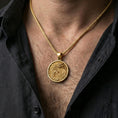 Load image into Gallery viewer, Gold plated dragon medallion pendant necklace worn on the neck, lifestyle photo featuring warm tone finish and strong statement medallion presence.