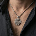 Load image into Gallery viewer, Oxidized dragon medallion pendant necklace worn on the neck, lifestyle framing showing realistic scale and bold vintage contrast against the chest.