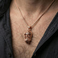 Load image into Gallery viewer, Rose gold plated Odin pendant necklace worn on the neck, lifestyle wear shot with elegant rosy shine and crisp Viking helmet-and-beard detailing visible.