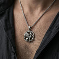 Load image into Gallery viewer, Oxidized griffin pendant necklace worn on the neck, lifestyle framing showing realistic scale and bold vintage contrast against the chest.