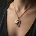 Load image into Gallery viewer, Rose gold plated Athena warrior pendant necklace worn on the neck, lifestyle wear shot with elegant rosy shine and crisp Greek key border detailing visible.